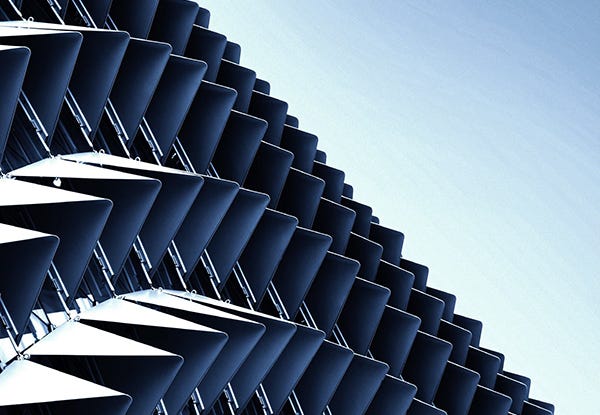 Abstract close-up view of modern aluminum ventilated facade of triangles